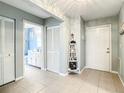 Well-lit foyer features tile flooring and access to the bath at 116 Duck Hawk Cir # 3040, Daytona Beach, FL 32119