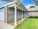 Inviting front porch with brick facade and manicured lawn at 116 Duck Hawk Cir # 3040, Daytona Beach, FL 32119
