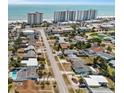 Aerial view showcasing neighborhood, proximity to the beach and nearby high-rise buildings at 13 Essex Dr, Ormond Beach, FL 32176