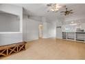 Open-concept living room with vaulted ceilings, breakfast bar, and modern wood floors at 160 Reserve Cir # 204, Oviedo, FL 32765