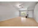 Bright living room featuring high ceilings, a large window, and light wood floors at 160 Reserve Cir # 204, Oviedo, FL 32765