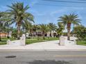 Stunning waterfront home featuring mature palms and a decorative, patterned driveway at 1601 S Riverside Dr, Edgewater, FL 32132