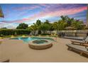 Inviting backyard with a pool, hot tub, sundeck, and mature landscaping at 2548 E Compton St, Orlando, FL 32806