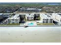 Breathtaking aerial view of Castle Reef Condominiums with beach access and oceanfront pool in Daytona Beach Shores, Florida at 4175 S Atlantic Ave # 5280, New Smyrna Beach, FL 32169