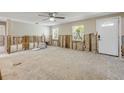 Spacious living room ready for renovation with ample natural light and front door at 431 Palmetto St, Edgewater, FL 32132