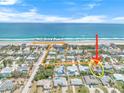 Stunning aerial view of neighborhood near 'No Drive Beach', showcasing the home's proximity to the ocean at 4350 Candlewood Ln, Ponce Inlet, FL 32127