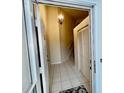 Inviting tiled foyer with elegant chandelier and convenient closet space at 439 Bouchelle Dr # 202, New Smyrna Beach, FL 32169