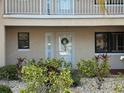 Charming condo exterior with attractive landscaping and a welcoming front door at 460 Bouchelle Dr # 104, New Smyrna Beach, FL 32169