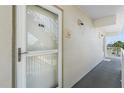 Image shows the front door to the condo with the unit number and well-maintained exterior at 4841 Saxon Dr # C201, New Smyrna Beach, FL 32169