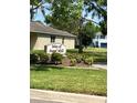 Isles of Sugar Mill community sign in front of a well-maintained lawn at 519 Aeolian Dr, New Smyrna Beach, FL 32168
