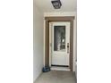 A white front door with decorative glass details and a 'Welcome' stone decor at 519 Aeolian Dr, New Smyrna Beach, FL 32168