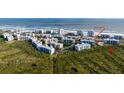 An aerial view shows desirable beach access for these beautiful condominiums at 5300 S Atlantic Ave # 17-207, New Smyrna Beach, FL 32169