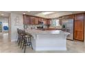 Gourmet kitchen featuring granite countertops, stainless steel appliances, and ample counter space at 5300 S Atlantic Ave # 17-207, New Smyrna Beach, FL 32169