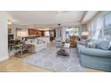 The spacious living room is illuminated by natural light and seamlessly connects to the gourmet kitchen at 5300 S Atlantic Ave # 17-207, New Smyrna Beach, FL 32169