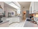 Bright kitchen featuring white cabinetry, modern appliances, and ample counter space at 5430 Dubois Ave, Port Orange, FL 32127