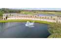 A scenic view of the Venetian Bay community featuring a water feature and golf course at 610 Mura Ct, New Smyrna Beach, FL 32168