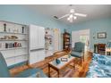 Comfortable living room with stylish furnishings, wood floors, and natural light at 6361 Turtlemound Rd, New Smyrna Beach, FL 32169