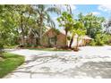 Charming single-story brick home with a three car garage, and a large driveway at 682 Ferncliff Dr, Port Orange, FL 32127