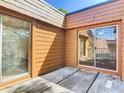 Private outdoor patio area featuring sliding glass doors and wood siding, great for relaxing or entertaining at 95 Moonstone Ct, Port Orange, FL 32129