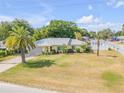 Inviting single-story home with lush landscaping and a well-kept lawn in a desirable neighborhood at 995 16Th St, Edgewater, FL 32132