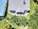 Aerial view of the home showcasing a private backyard with a patio and lush landscaping at 1307 Wayne Ave, New Smyrna Beach, FL 32168