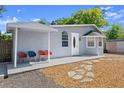 Inviting covered patio with chairs, perfect for outdoor relaxation at 135 12Th St, Daytona Beach, FL 32117