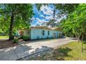 Well-maintained home featuring a two-car garage and long driveway, ideal for parking and storage at 1786 Taylor Rd, Port Orange, FL 32128