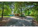 A charming one-story home surrounded by mature trees offering natural shade and curb appeal at 1786 Taylor Rd, Port Orange, FL 32128