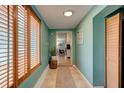 Inviting hallway featuring warm natural light and a view to other living spaces in the home at 184 Azalea Rd, Edgewater, FL 32141
