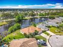 Wide aerial view of a waterfront home highlighting its serene water view and landscaping at 1840 Tara Marie Ln, Port Orange, FL 32128