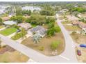 Aerial view of the home showcasing its location on a corner lot and beautiful landscaping at 2435 Alton Rd, Deltona, FL 32738