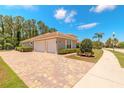 Spacious three-car garage and paver driveway add to the appeal of this lovely home at 260 Portofino Blvd, New Smyrna Beach, FL 32168