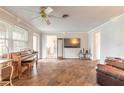 Spacious living room featuring hardwood floors and a ceiling fan at 306 Jefferson Ave, Port Orange, FL 32127