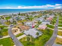 Gorgeous aerial view of a coastal community with beach access and lush landscaping near the Intercoastal waterway at 31 E Sea Harbor, Ormond Beach, FL 32176