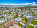 Aerial shot of a quiet residential neighborhood near the Intercoastal waterway, showcasing well-maintained lawns and cozy homes at 31 E Sea Harbor, Ormond Beach, FL 32176