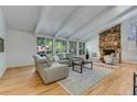 Spacious living room featuring vaulted ceilings, fireplace, and stylish furniture at 315 Sweet Bay Ave, New Smyrna Beach, FL 32168