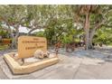 Attractive community sign for Coronado Cove & Cedar Dunes surrounded by lush landscaping at 3808 Saxon Dr, New Smyrna Beach, FL 32169