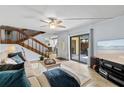 The living room features lots of natural light and easy access to outdoor patio at 3808 Saxon Dr, New Smyrna Beach, FL 32169