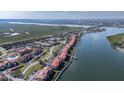 Aerial view of the waterfront community, showcasing the complex's boat docks and proximity to the Halifax River at 402 Bouchelle Dr # 205, New Smyrna Beach, FL 32169