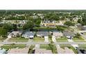 Scenic aerial view of a neighborhood with well-maintained homes and beautiful water views at 404 Central Mariners Dr, Edgewater, FL 32141