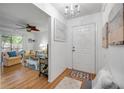 Inviting entryway with a glimpse of the living room and comfortable seating at 412 Banana Cay Dr # A, South Daytona, FL 32119