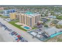 Aerial view of the beachfront condo, pool, manicured lawns and convenient parking at 421 S Atlantic Ave # 507, New Smyrna Beach, FL 32169