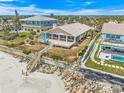 Beach home with a deck, stairs to the beach, and outdoor seating for enjoying ocean breezes and views at 4323 S Atlantic Ave, Port Orange, FL 32127