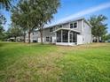This home has a screened in porch and a spacious green backyard at 567 Mount Olympus Blvd, New Smyrna Beach, FL 32168