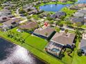 An aerial view of a green backyard with a pond, highlighting its position and beautiful landscaping at 637 Marisol Dr, New Smyrna Beach, FL 32168