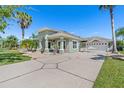 Beautiful single-story home with an attached two-car garage and a well manicured front yard at 637 Marisol Dr, New Smyrna Beach, FL 32168