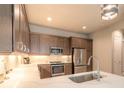 Beautifully updated kitchen featuring stainless steel appliances and breakfast bar seating at 6456 Roseberry Ct, Port Orange, FL 32128