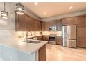 Modern kitchen featuring stainless steel appliances, custom cabinets, and stylish countertops at 6456 Roseberry Ct, Port Orange, FL 32128
