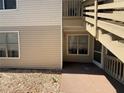A patio with exterior stairs to an upper unit provides outdoor space and private access at 1600 Big Tree Rd # L1, South Daytona, FL 32119
