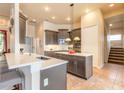 Modern kitchen with stainless steel appliances, granite countertops, and pendant lighting at 1734 Covendale Ln, Port Orange, FL 32128